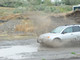 10699Amy_MattDrivingThroughMud_11.JPG